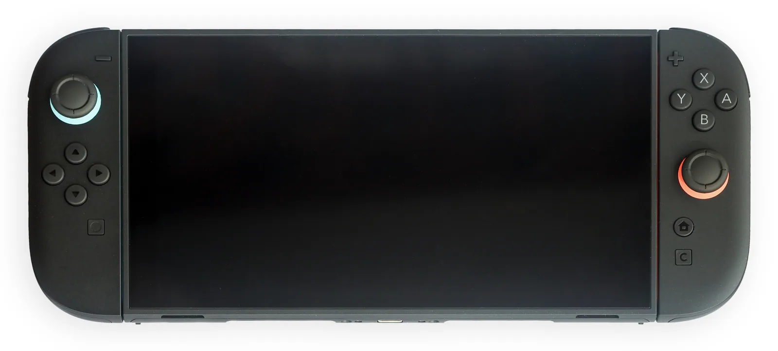 La Nintendo Switch 2 en mode portable, vue de face, écran éteint, avec ses deux Joy-Con 2 gris anthracite fixés de part et d'autre de l'écran de 7,9 pouces.
